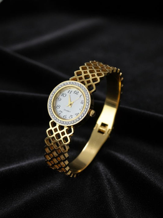 Gold wristwatch with diamond-studded face on a black background