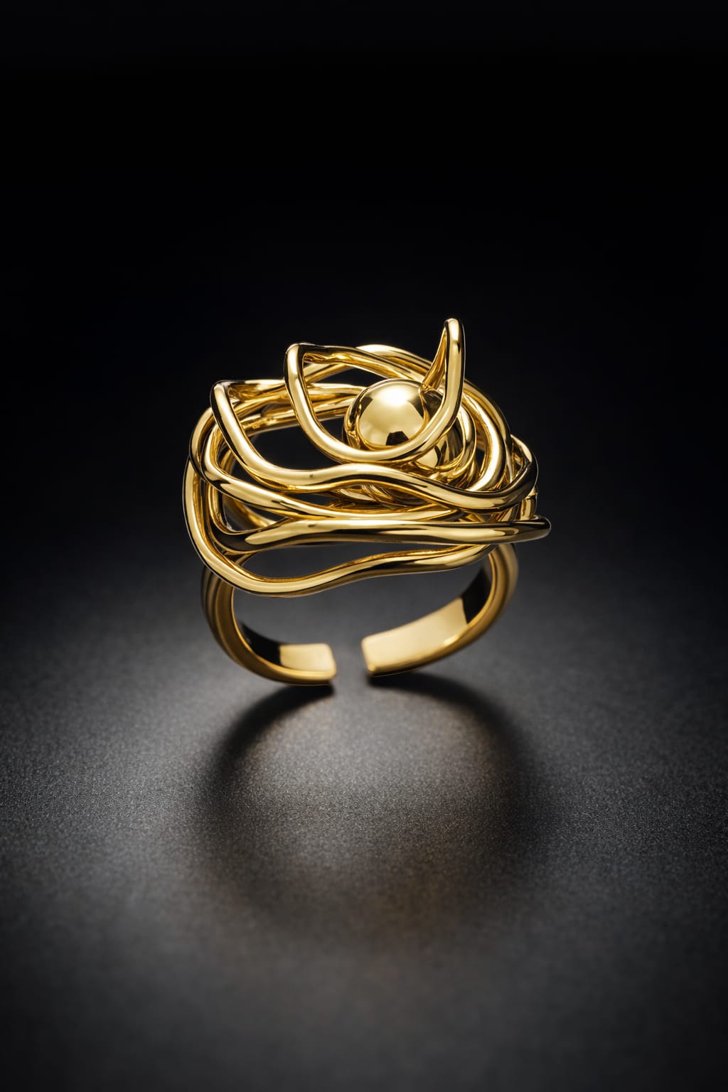Gold ring with a unique design on a black background