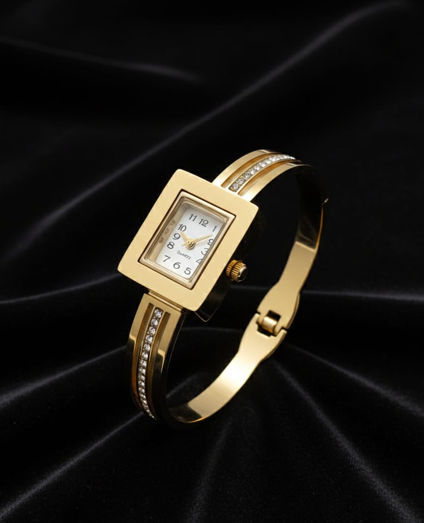 Gold wristwatch with a square face on a black satin background