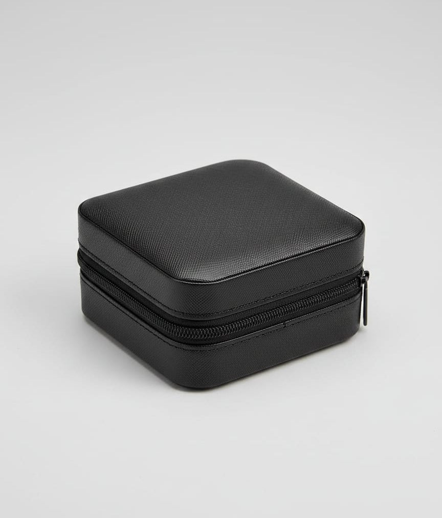 Black double-layered travel case on a white background